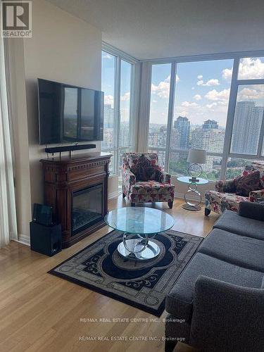 2402 - 220 Burnhamthorpe Road W, Mississauga, ON - Indoor Photo Showing Living Room With Fireplace