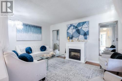 47 Butterfield Crescent, Whitby, ON - Indoor Photo Showing Living Room With Fireplace