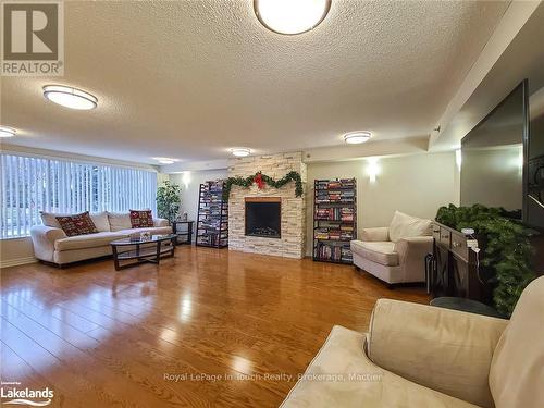 702 - 699 Aberdeen Boulevard, Midland, ON - Indoor Photo Showing Living Room With Fireplace