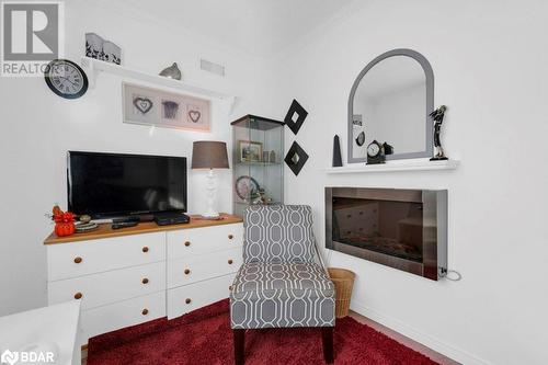 Sitting room featuring ornamental molding and carpet floors - 30 Kenneth Boulevard, Quinte West, ON - Indoor With Fireplace