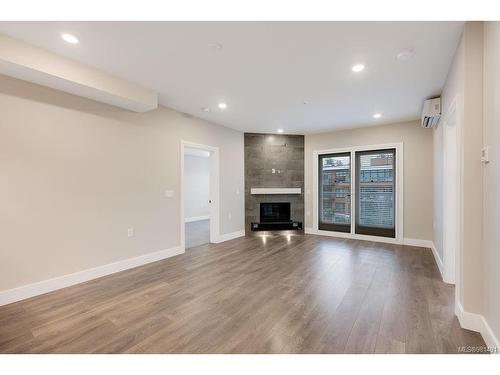 401-741 Travino Lane, Saanich, BC - Indoor Photo Showing Other Room With Fireplace