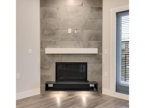 401-741 Travino Lane, Saanich, BC - Indoor Photo Showing Living Room With Fireplace