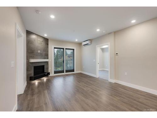 401-741 Travino Lane, Saanich, BC - Indoor With Fireplace