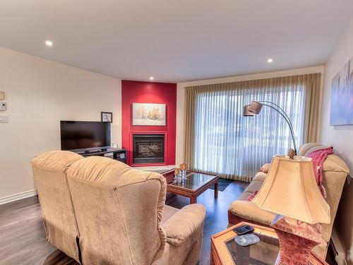 Living room - 3610 Rue Elsa-Triolet, Laval (Chomedey), QC - Indoor Photo Showing Living Room With Fireplace