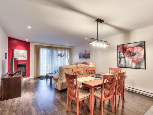 Dining room - 3610 Rue Elsa-Triolet, Laval (Chomedey), QC - Indoor Photo Showing Dining Room With Fireplace