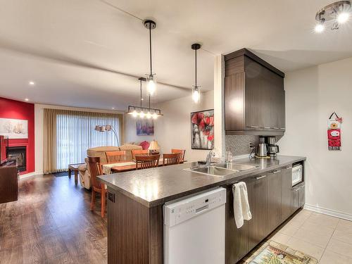 Kitchen - 3610 Rue Elsa-Triolet, Laval (Chomedey), QC - Indoor Photo Showing Kitchen With Fireplace With Double Sink