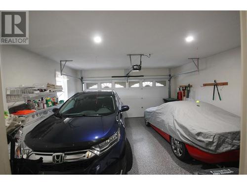 Double Car Garage - 1634 Carmi Avenue Unit# 129, Penticton, BC - Indoor Photo Showing Garage