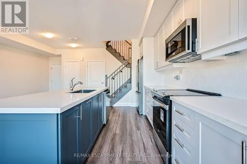 115 - 1569 Rose Way, Milton, ON - Indoor Photo Showing Kitchen With Upgraded Kitchen