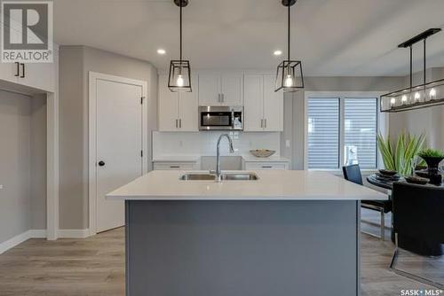 126 Kostiuk Crescent, Saskatoon, SK - Indoor Photo Showing Kitchen With Double Sink With Upgraded Kitchen