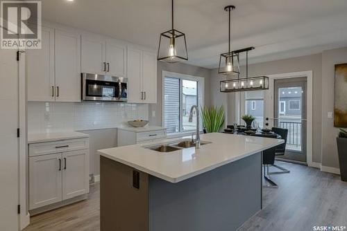 126 Kostiuk Crescent, Saskatoon, SK - Indoor Photo Showing Kitchen With Double Sink With Upgraded Kitchen