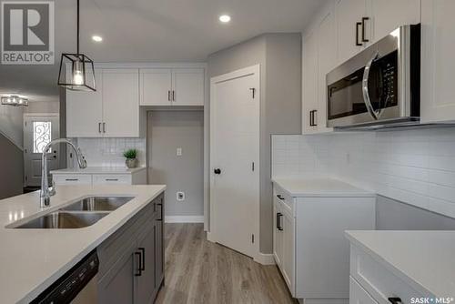 126 Kostiuk Crescent, Saskatoon, SK - Indoor Photo Showing Kitchen With Double Sink