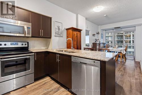 1306 - 65 Speers Road, Oakville, ON - Indoor Photo Showing Kitchen With Stainless Steel Kitchen With Double Sink