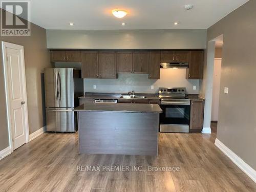 110 - 299 Cundles Road E, Barrie, ON - Indoor Photo Showing Kitchen With Stainless Steel Kitchen With Double Sink