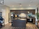 110 - 299 Cundles Road E, Barrie, ON  - Indoor Photo Showing Kitchen With Stainless Steel Kitchen With Double Sink 