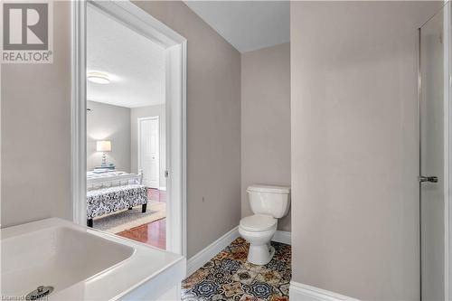 Bathroom featuring tile patterned floors and toilet - 5819 Wellington Cty Rd 7, Guelph, ON 