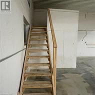 Stairs featuring concrete flooring - 