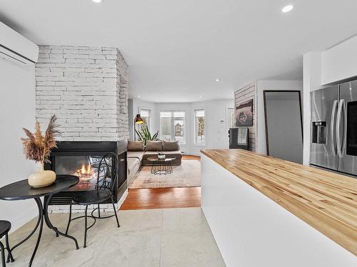 Dinette - 200 Rue Dessureault, Mont-Tremblant, QC - Indoor Photo Showing Living Room With Fireplace