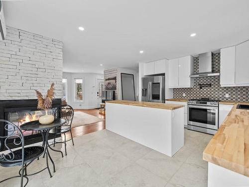 Kitchen - 200 Rue Dessureault, Mont-Tremblant, QC - Indoor Photo Showing Kitchen With Fireplace With Upgraded Kitchen