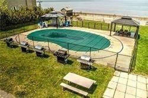 1-734 Shore Lane, Wasaga Beach, ON - Outdoor With Body Of Water With In Ground Pool With Backyard