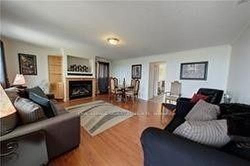 1-734 Shore Lane, Wasaga Beach, ON - Indoor Photo Showing Living Room With Fireplace