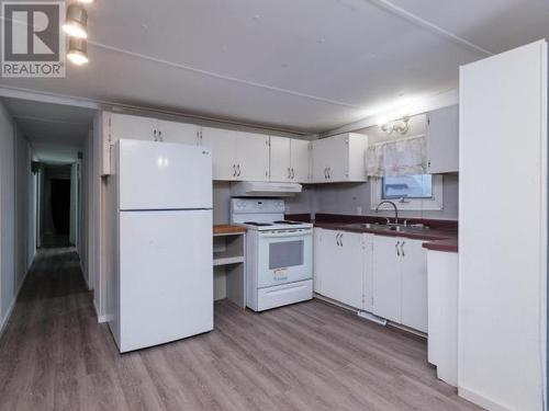 221-200 Lobird Road, Whitehorse, YT - Indoor Photo Showing Kitchen With Double Sink