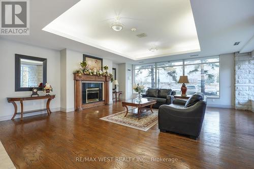 203 - 2502 Rutherford Road, Vaughan, ON - Indoor Photo Showing Living Room With Fireplace