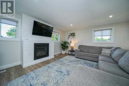 11 Eilber Street, Lambton Shores (Grand Bend), ON - Indoor Photo Showing Living Room With Fireplace