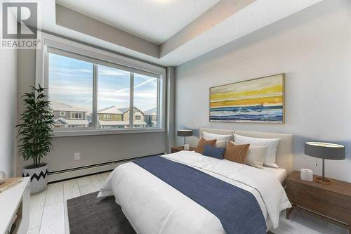 1208, 111 Wolf Creek Drive, Calgary, AB - Indoor Photo Showing Bedroom