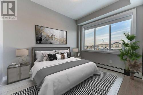 1208, 111 Wolf Creek Drive, Calgary, AB - Indoor Photo Showing Bedroom