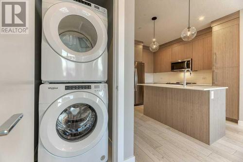 1208, 111 Wolf Creek Drive, Calgary, AB - Indoor Photo Showing Laundry Room