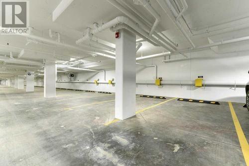 Titled Parking spot - 1208, 111 Wolf Creek Drive, Calgary, AB - Indoor Photo Showing Garage