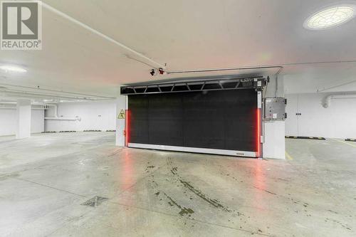 1208, 111 Wolf Creek Drive, Calgary, AB - Indoor Photo Showing Garage