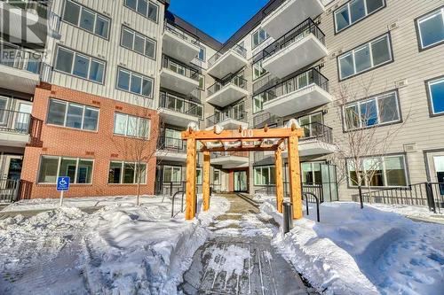 1208, 111 Wolf Creek Drive, Calgary, AB - Outdoor With Balcony With Facade