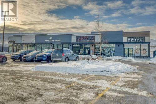 shop across the street! - 1208, 111 Wolf Creek Drive, Calgary, AB - Outdoor With Balcony