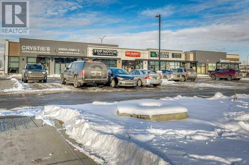 Shop across the street - 1208, 111 Wolf Creek Drive, Calgary, AB - Outdoor With View