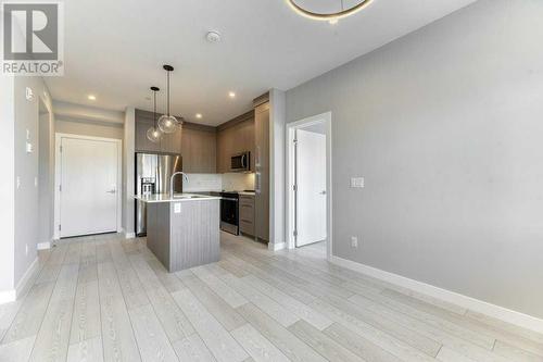 1208, 111 Wolf Creek Drive, Calgary, AB - Indoor Photo Showing Kitchen