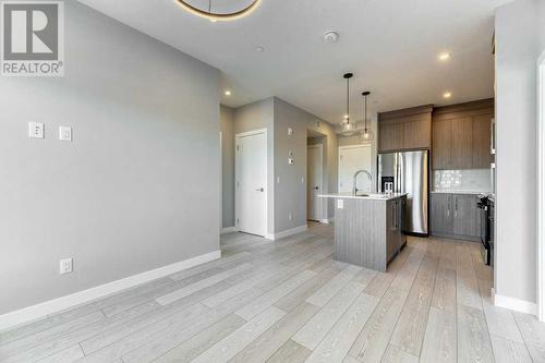 1208, 111 Wolf Creek Drive, Calgary, AB - Indoor Photo Showing Kitchen