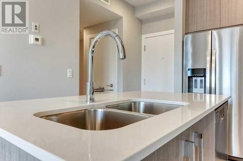 1208, 111 Wolf Creek Drive, Calgary, AB - Indoor Photo Showing Kitchen With Double Sink