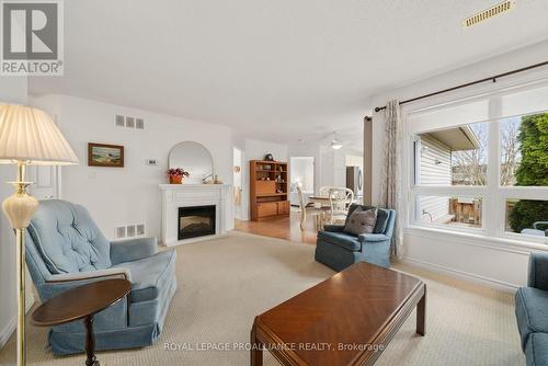 11 - 15 Aldersgate Drive, Belleville, ON - Indoor Photo Showing Living Room With Fireplace