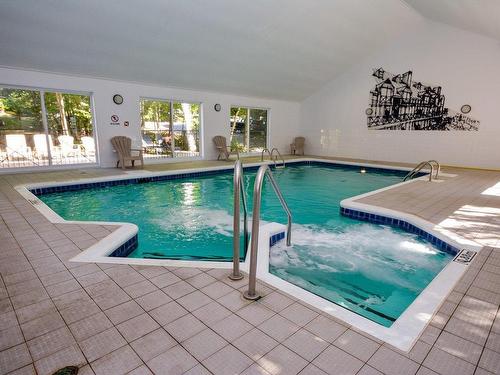 Pool - 203-280 Ch. Des Faîtières, Piedmont, QC - Indoor Photo Showing Other Room With In Ground Pool