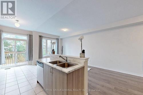 22 Greenwood Drive, Essa, ON - Indoor Photo Showing Kitchen With Double Sink