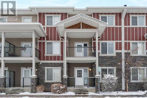 52 West Caoch Manor Sw, Calgary, AB - Outdoor With Balcony With Facade