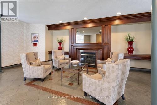 225 - 8111 Forest Glen Drive, Niagara Falls (Mt. Carmel), ON - Indoor Photo Showing Living Room With Fireplace