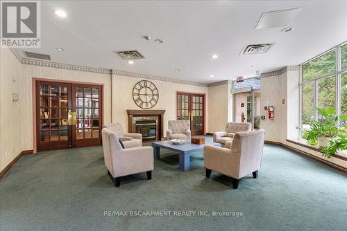 225 - 8111 Forest Glen Drive, Niagara Falls (Mt. Carmel), ON - Indoor Photo Showing Living Room With Fireplace