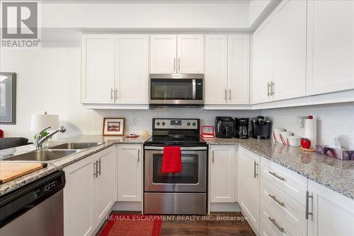 225 - 8111 Forest Glen Drive, Niagara Falls (Mt. Carmel), ON - Indoor Photo Showing Kitchen With Double Sink