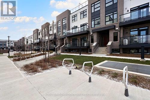 108 - 1565 Rose Way, Milton, ON - Outdoor With Balcony With Facade