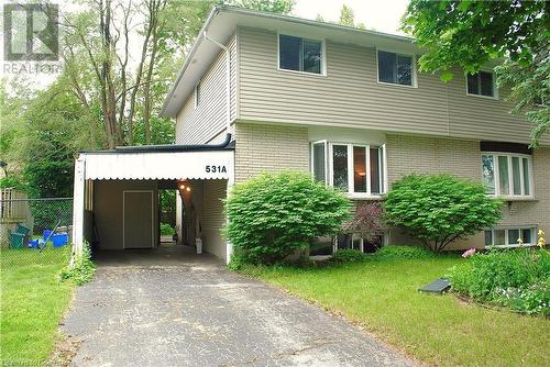 View of front of home featuring a front yard and a carport - 531 Brookhaven Crescent Unit# A, Waterloo, ON - Outdoor