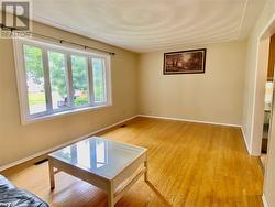 Empty room with hardwood / wood-style floors - 