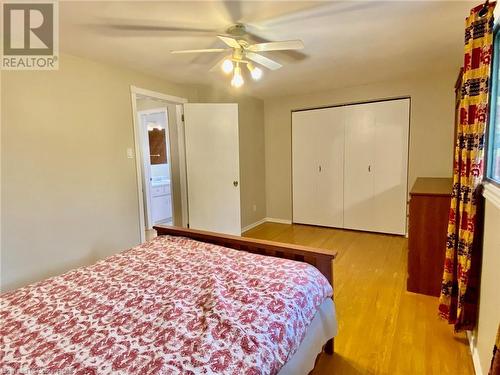 Bedroom featuring ceiling fan, a closet, and light hardwood / wood-style flooring - 531 Brookhaven Crescent Unit# A, Waterloo, ON - Indoor Photo Showing Bedroom