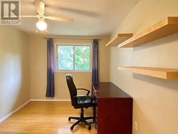 Office with ceiling fan and light hardwood / wood-style floors - 